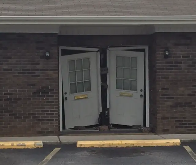 Police: woman drove through Madison County DMV doors